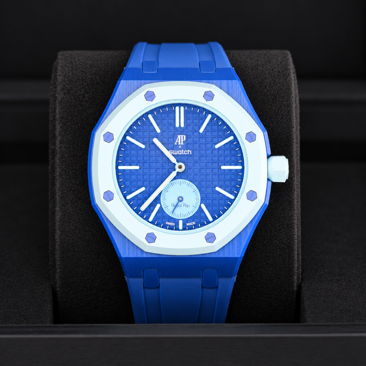 Swatch x AP Royal Pop LAN BA with blue rubber strap displayed upright in a black box