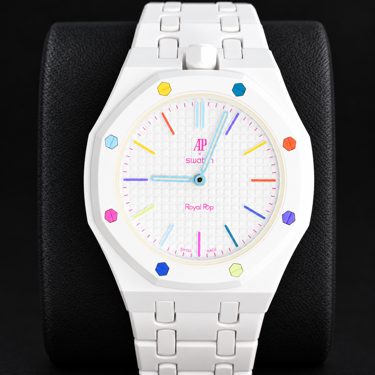 Swatch x Audemars Piguet Royal Pop HUIT BLANC front view with white linked bracelet on a black cushion