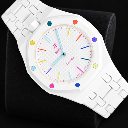 Royal Pop HUIT BLANC diagonal front view with white linked bracelet and multicoloured dial accents on a black cushion