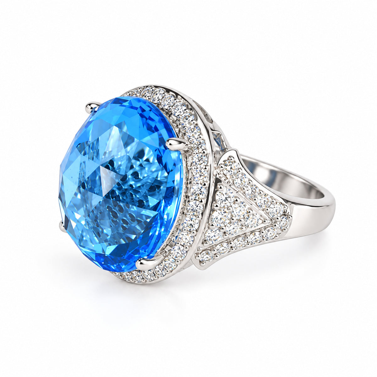 Angled view of oval blue topaz ring showing the natural diamond halo and diamond-set shoulders.
