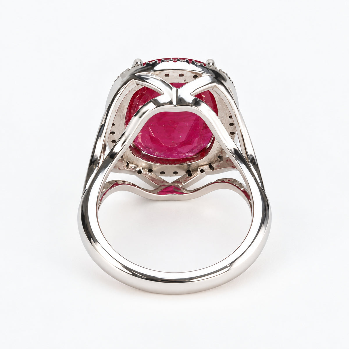 Underside of 18ct white gold glass-filled ruby and natural diamond halo ring showing the open gallery