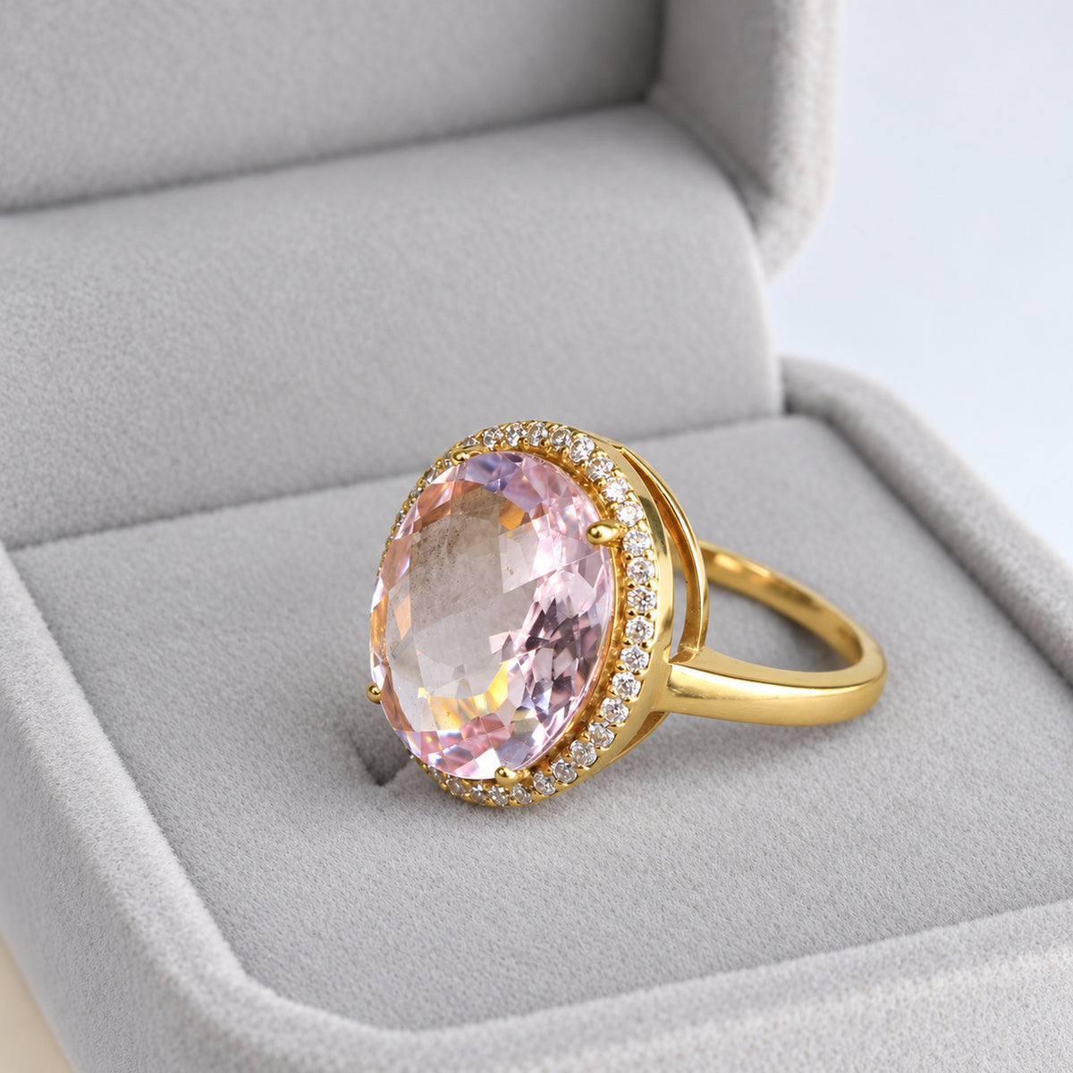 Back side profile of polished yellow gold ring revealing elevated oval morganite halo setting