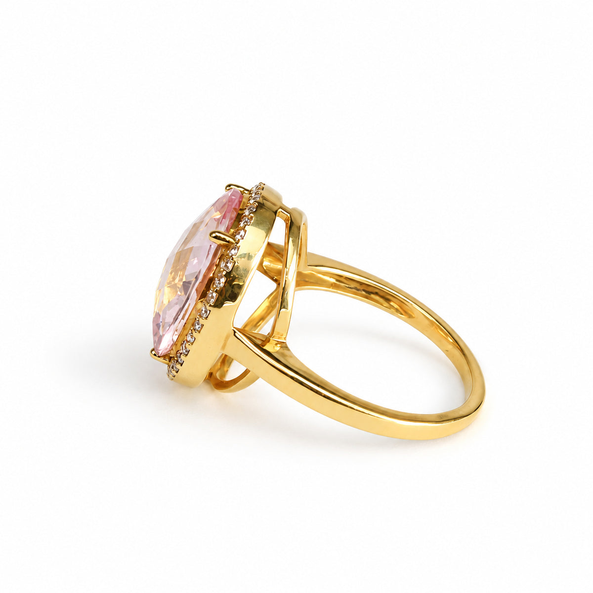 Close side view of raised gallery and oval pink beryl gemstone on 18ct yellow gold ring