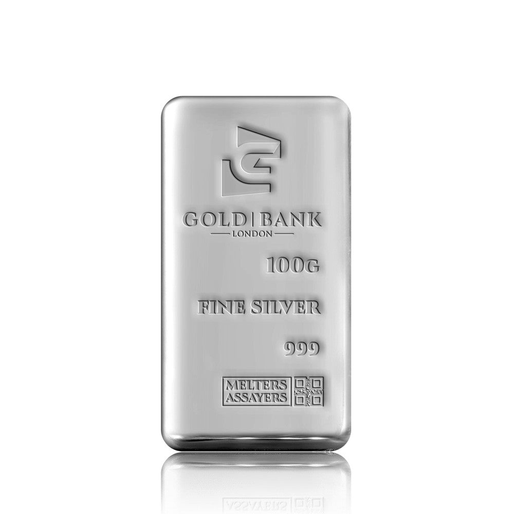 A 100g fine silver bar from Gold Bank London, featuring a polished metallic finish and engraved text, displayed on a clean white background with a subtle reflection below.