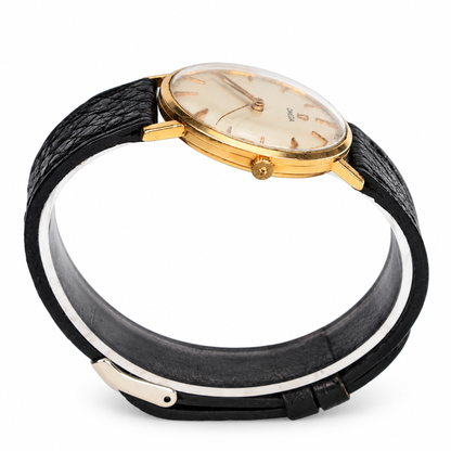 Vintage Omega mechanical dress watch with champagne dial and yellow gold-tone round case