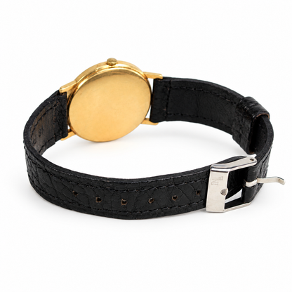 Vintage Omega dress watch with black leather strap, buckle and yellow gold-tone case
