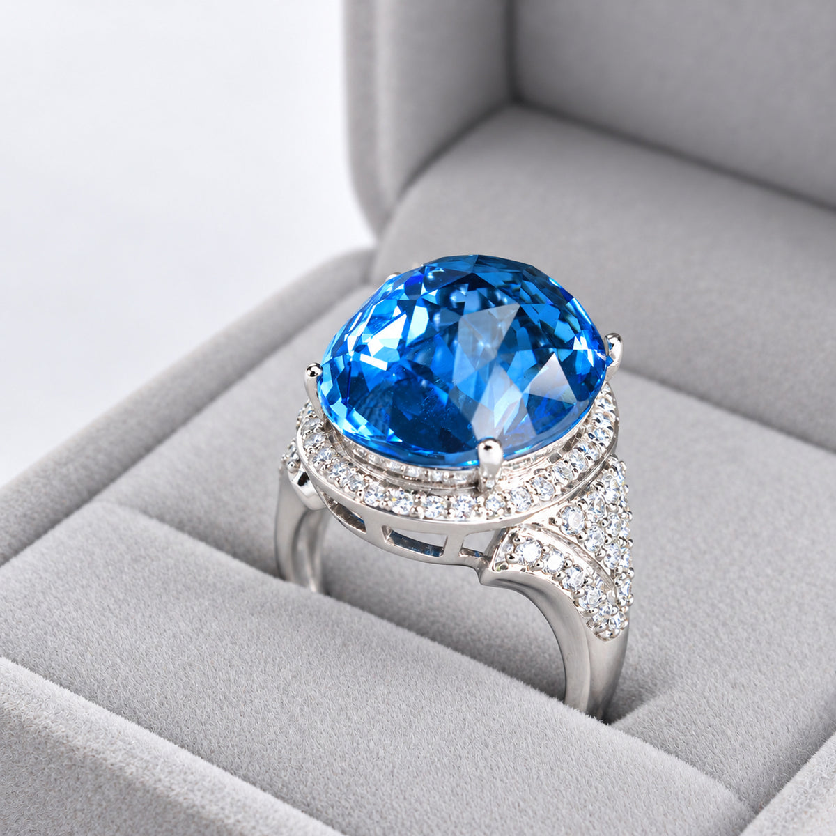 18ct White Gold Oval Blue Topaz & Diamond Halo Cocktail Ring