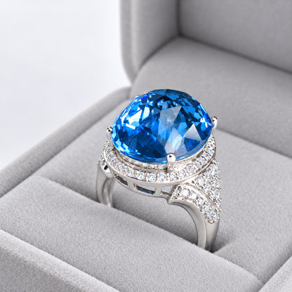 18ct White Gold Oval Blue Topaz & Diamond Halo Cocktail Ring