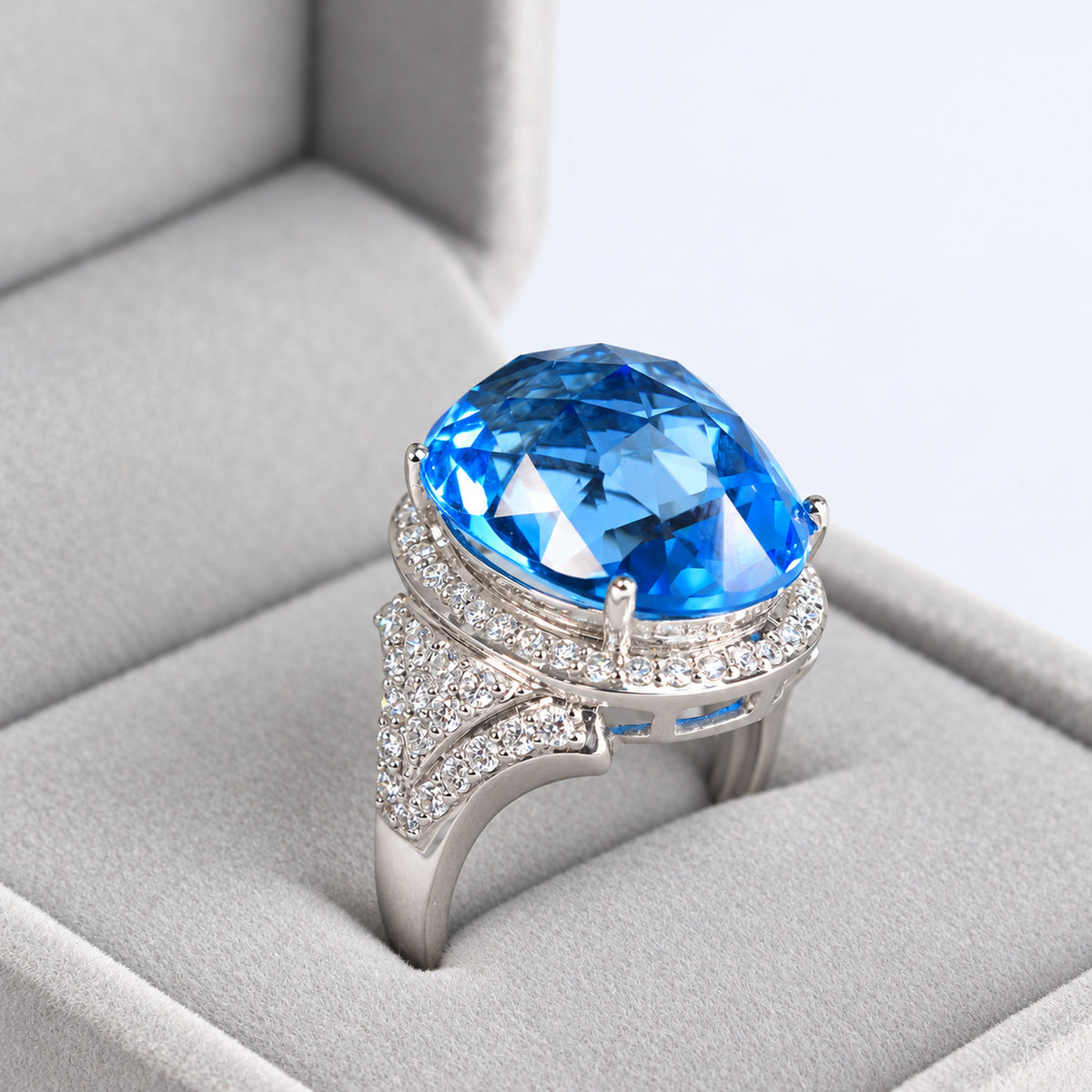 18ct White Gold Oval Blue Topaz & Diamond Halo Cocktail Ring