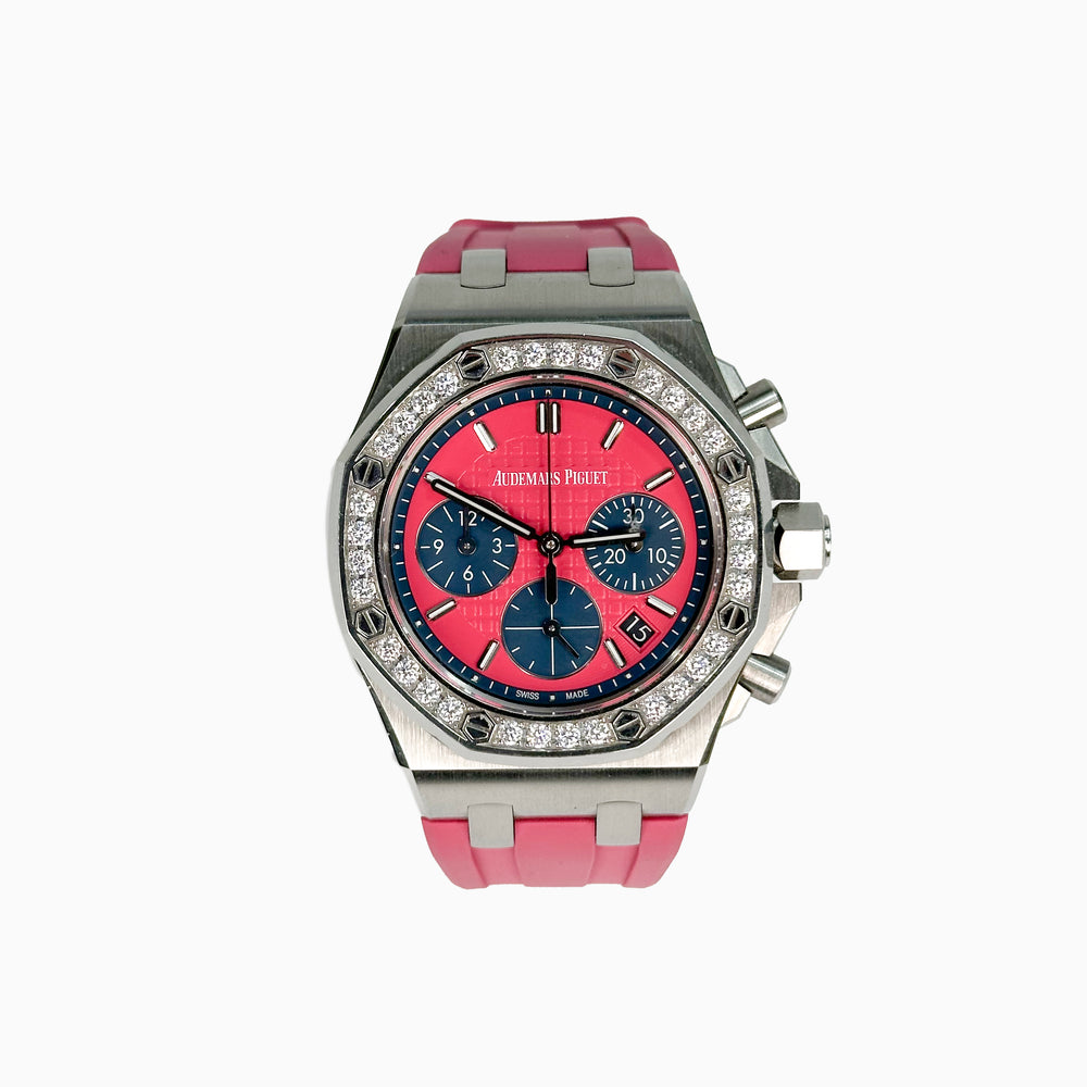Luxury watch with pink strap and pink face on a white background