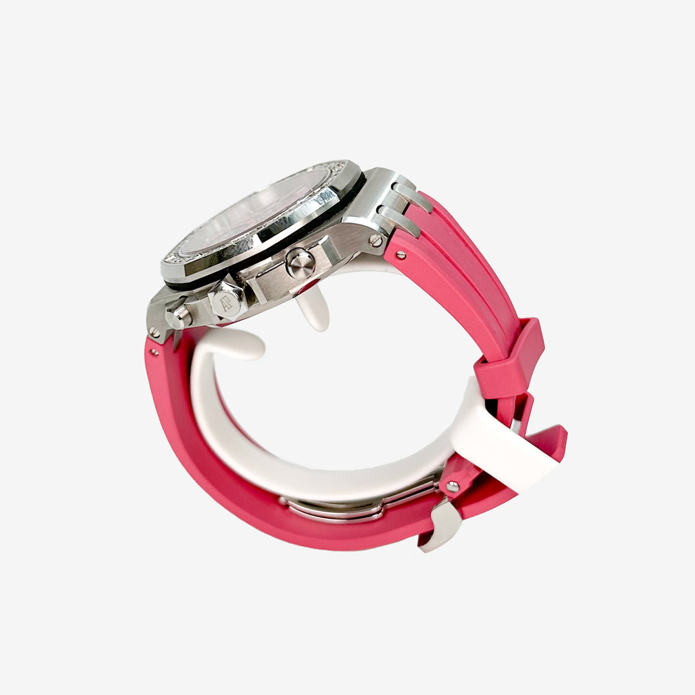 Close-up of a watch with a pink strap on a white background