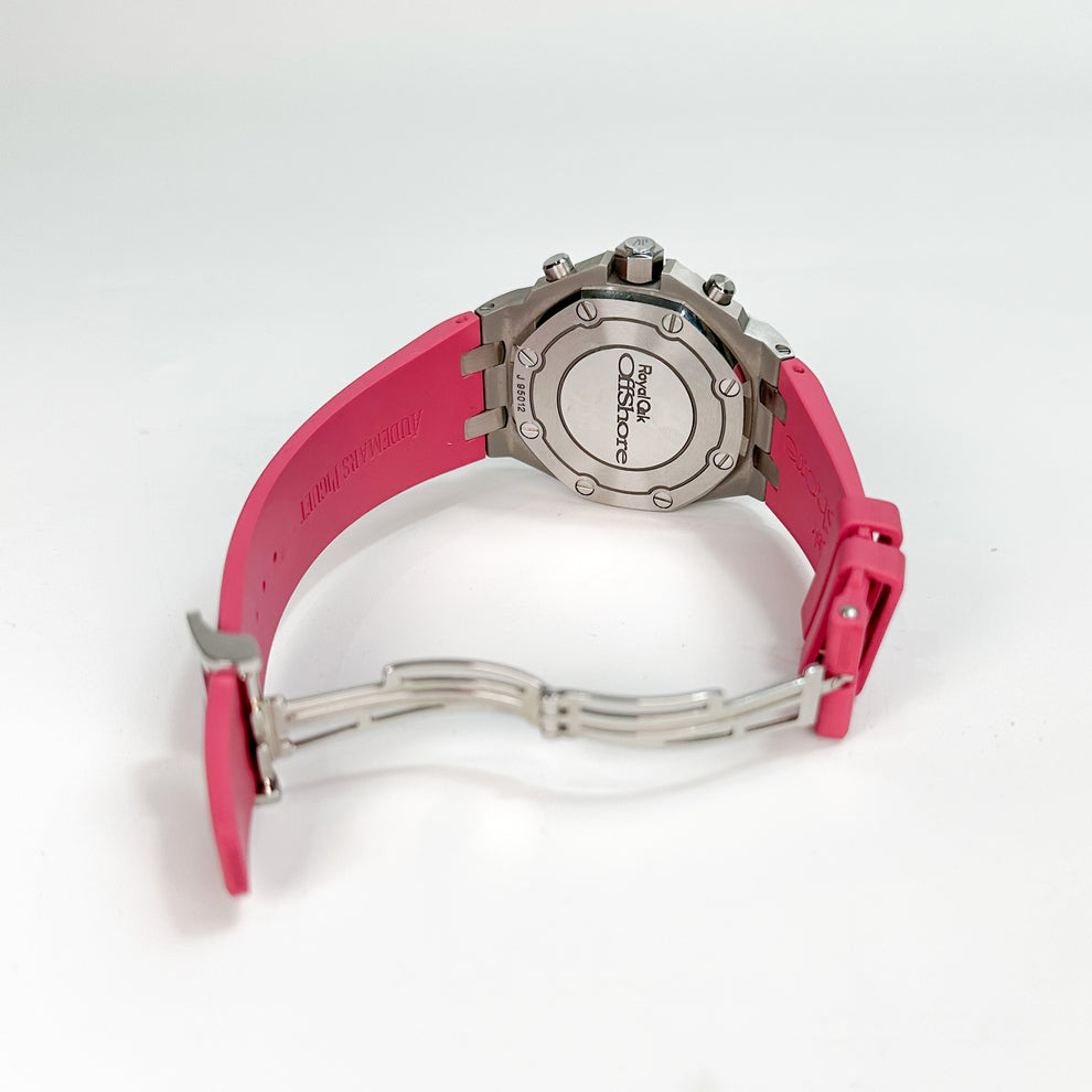 Watch with pink strap and silver case on a white background