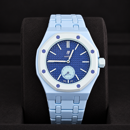 Royal Pop LAN BA front view with light-blue linked bracelet and dark-blue dial displayed on a black cushion