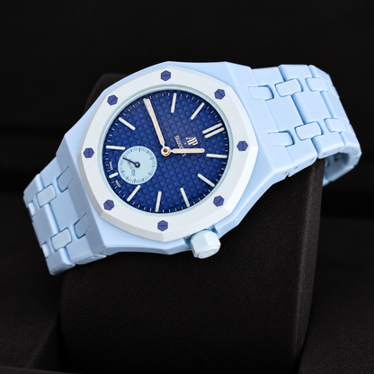 Royal Pop LAN BA angled view showing textured blue dial, small seconds subdial and light-blue linked bracelet