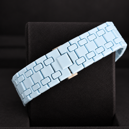 Royal Pop LAN BA light-blue linked bracelet and closed clasp shown on a black cushion
