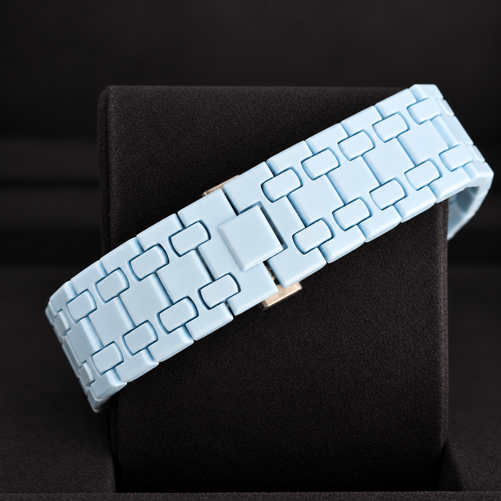 Royal Pop LAN BA light-blue linked bracelet and closed clasp shown on a black cushion