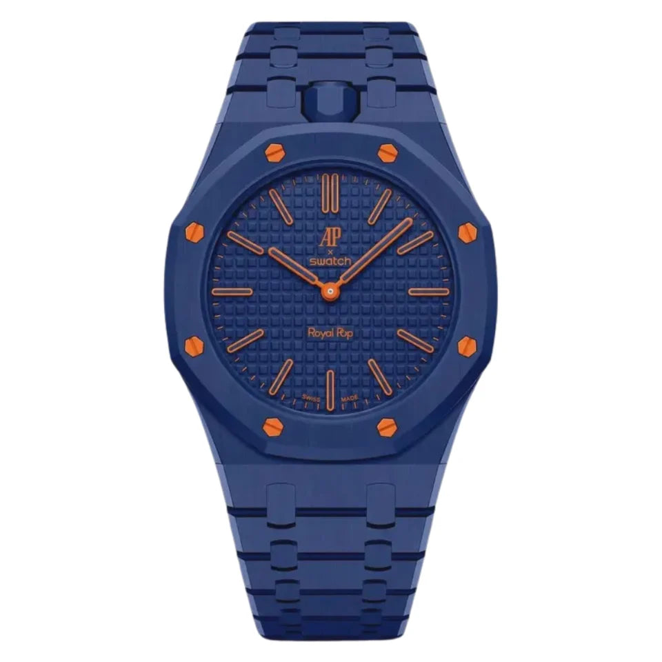 A Swatch x Audemarsoux Royal Bay watch featuring a deep blue bezel, textured blue dial, and blue link bracelet with orange accents on the hands, markers, and screw caps, shown against a plain white background.
