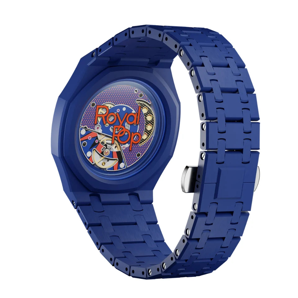 A blue analog watch with a matching blue link band, featuring a transparent dial that reveals internal gears and the words 'Royal Pop' in red and yellow.