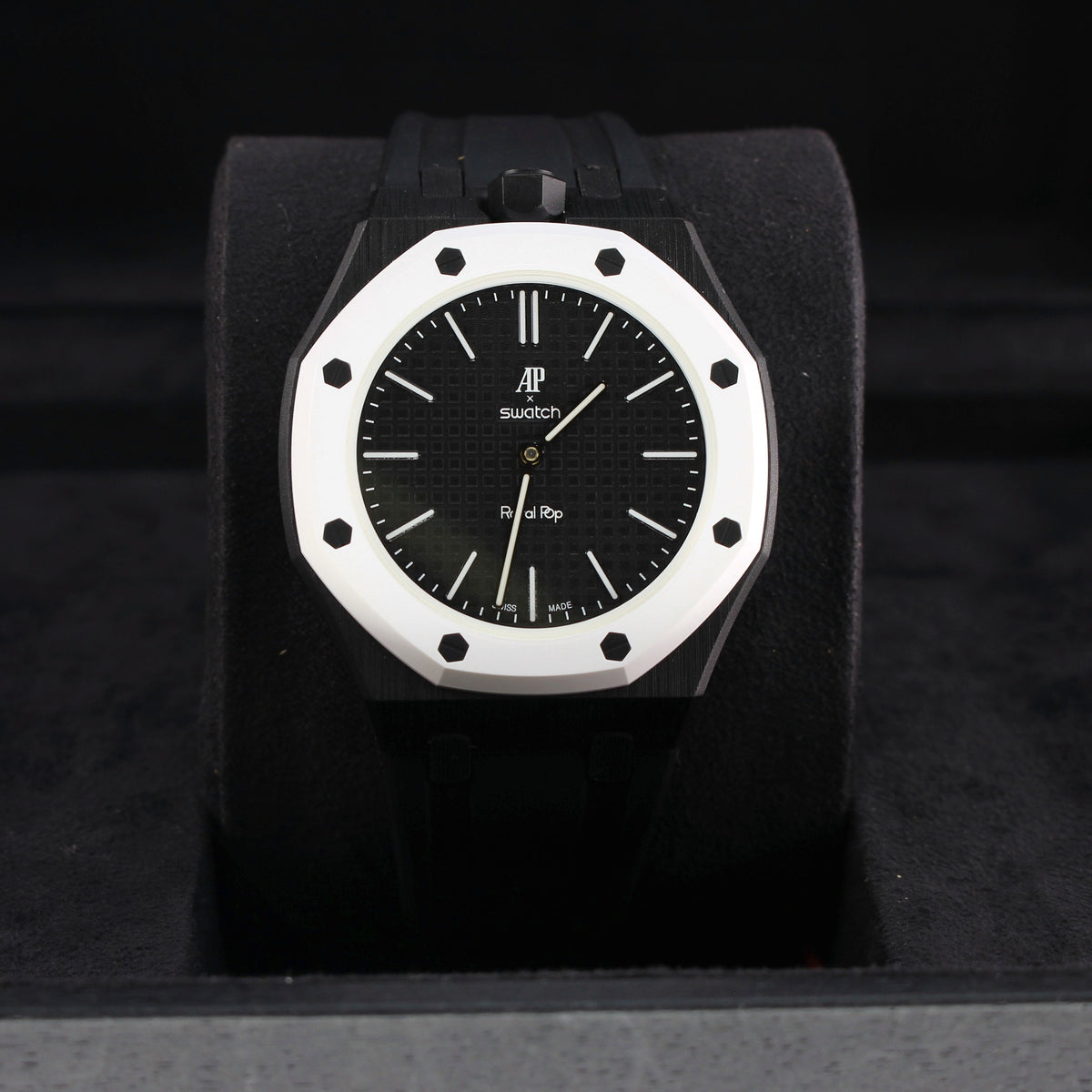 Royal Pop OCHO NEGRO with black strap and white octagonal bezel displayed upright on a black cushion