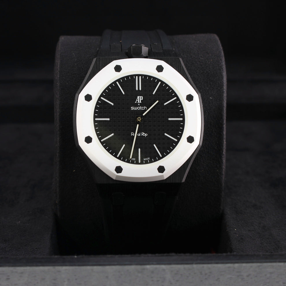 Royal Pop OCHO NEGRO with black strap and white octagonal bezel displayed upright on a black cushion