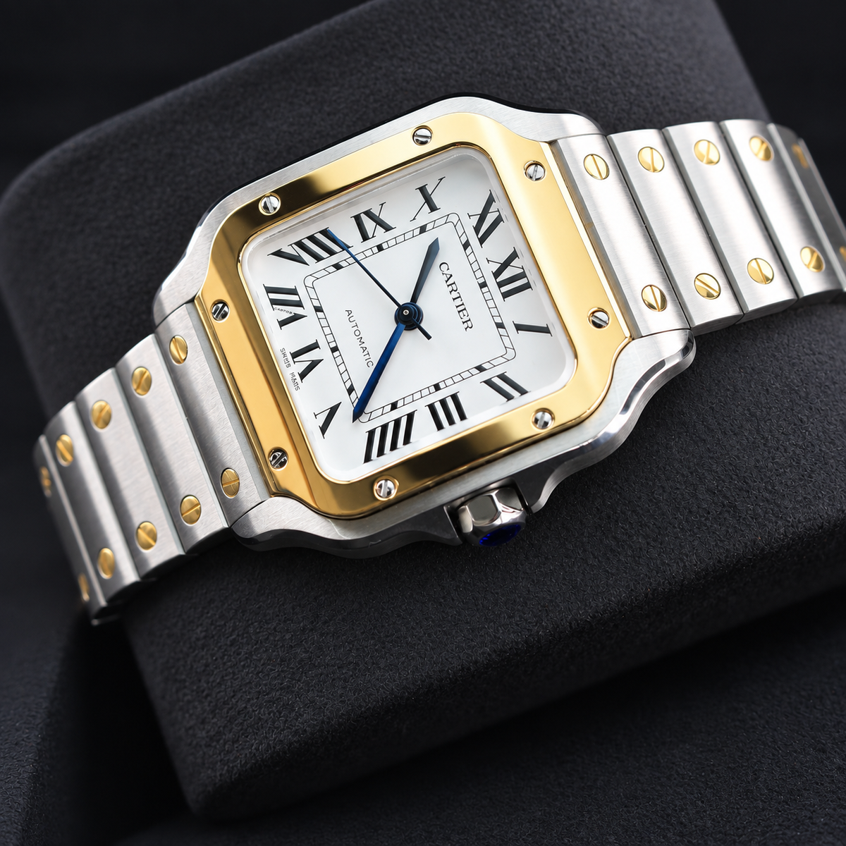Cartier Santos W2SA0016 three-quarter view showing yellow gold bezel and steel bracelet