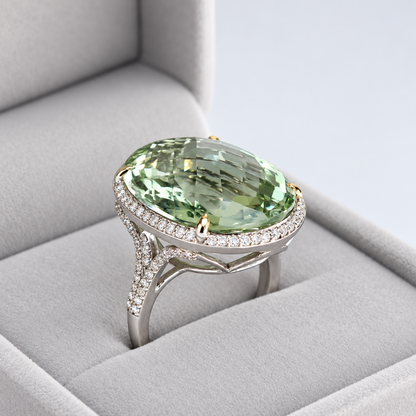 Three-quarter view of green amethyst ring showing faceted centre stone and diamond-set split shoulders