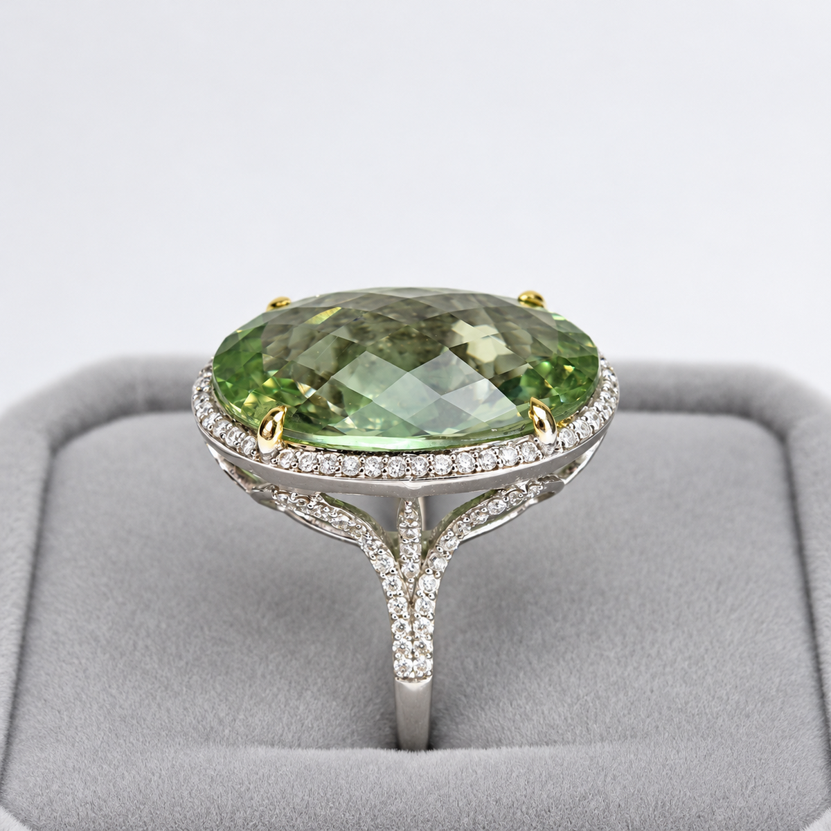 Side profile of green amethyst cocktail ring showing raised diamond halo and split shoulders