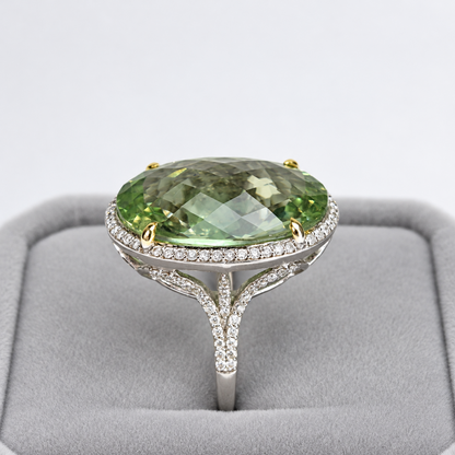 Side profile of green amethyst cocktail ring showing raised diamond halo and split shoulders