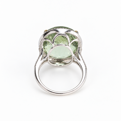 Underside of green amethyst ring showing open gallery and 18ct white gold band with diamond accents