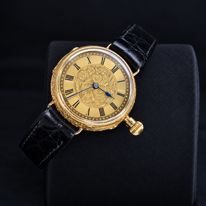 IWC vintage 18K yellow gold engraved Roman dial watch front three-quarter view