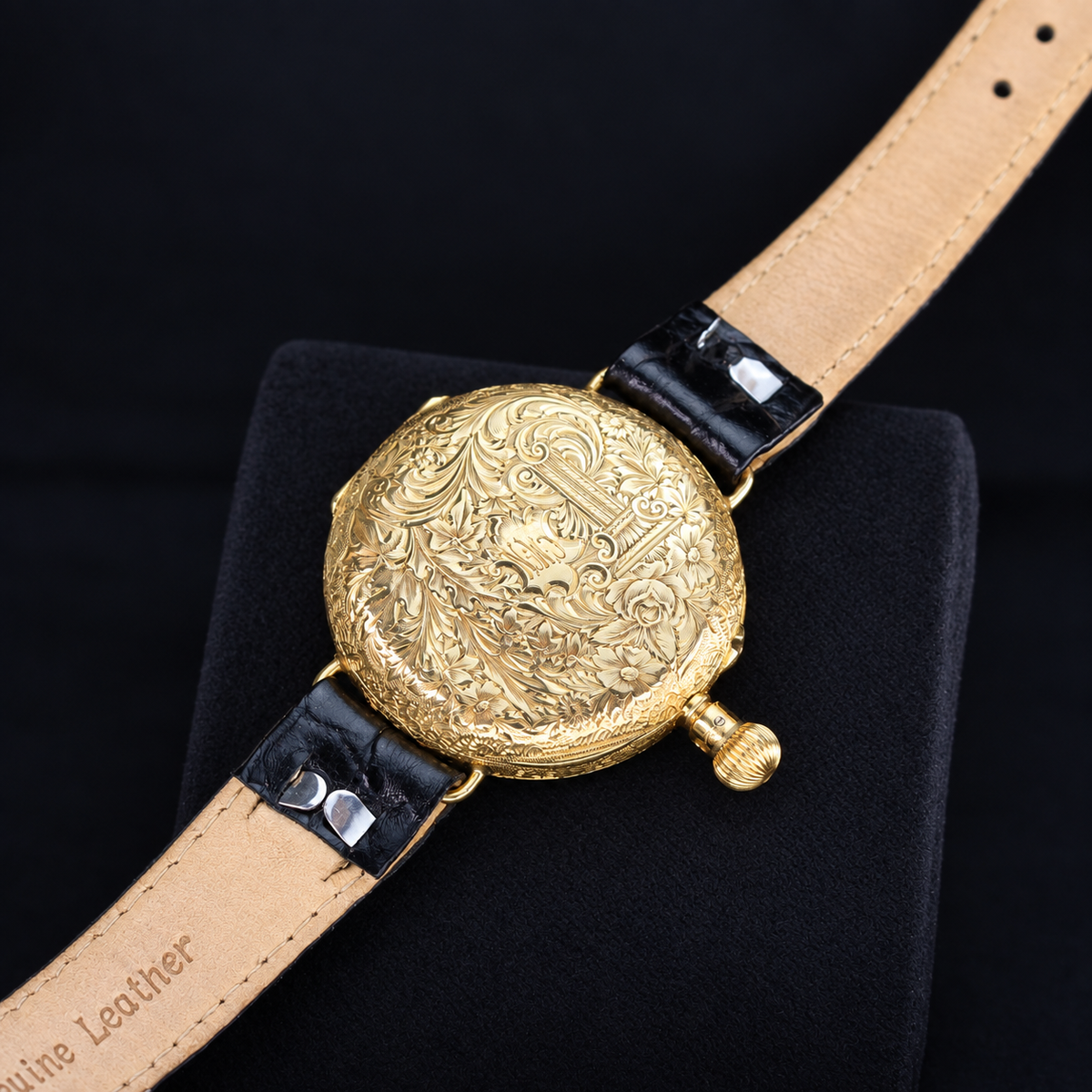 IWC vintage 18K yellow gold engraved caseback detail with black leather strap