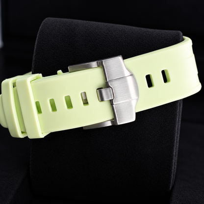 Royal Pop Blaue Acht lime watch strap with silver-tone buckle on a black cushion