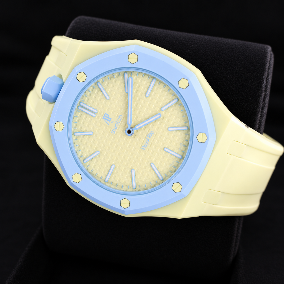Audemars Piguet x Swatch Royal Pop Blaue Acht lime dial and light-blue bezel displayed on a black cushion